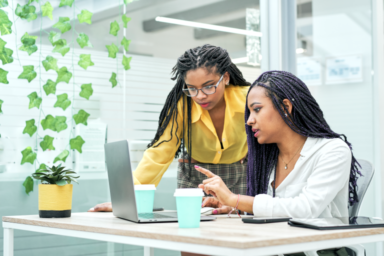 two-young-black-women-reviewing-analytical-data-on-2023-11-27-05-08-32-utc