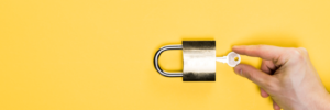 top-view-of-man-touching-key-in-metallic-padlock-i-2023-11-27-05-34-39-utc